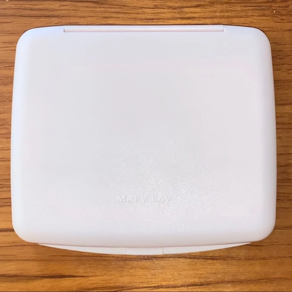 Mary Kay pink plastic compact travel mirror.